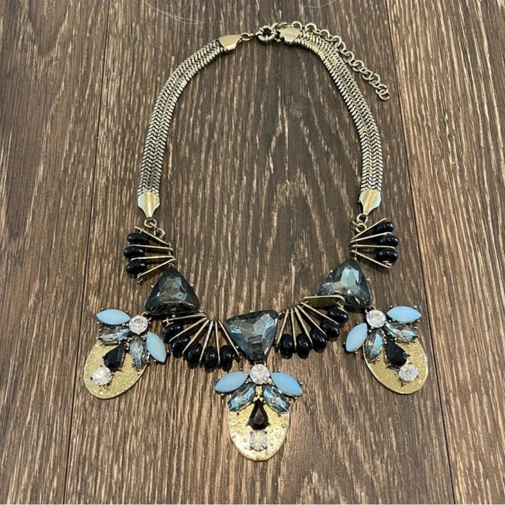 Elegant Gold and Black Necklace with Blue Highlights